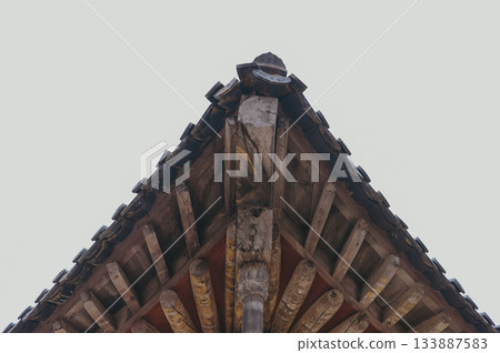 Sharp Eaves Line and Tiled Roof of a Traditional Korean House 133887583