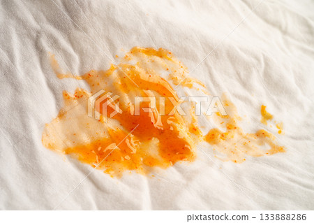 Dirty tomato sauce stain or ketchup on cloth to wash with washing powder, cleaning housework. 133888286