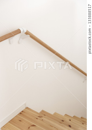 Close-up of wooden stairs and solid wood handrail Close-up of wooden stairs and solid wood handrail 133888517