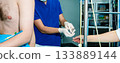 The anesthesiologist conducts and charges the syringe with anesthetics. 133889144