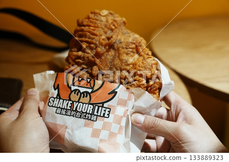 Eating Ji Pai at a Taiwanese night market Eating Ji Pai at a Taiwanese night market 133889323