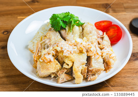 Khao man gai served on a white plate Khao man gai served on a white plate 133889445