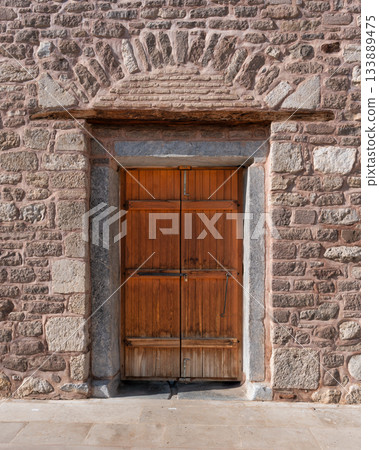Rustic wooden door and textured stone wall of Alaeddin Mosque, Konya, Turkey Rustic wooden door and textured stone wall of Alaeddin Mosque, Konya, Turkey 133889475