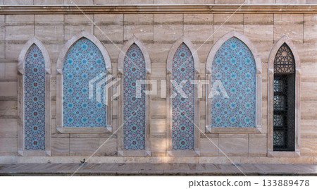 Exterior wall with intricate Islamic tile patterns and arches at War of Independence Martyrs' Monument, Konya, Turkey. 133889478