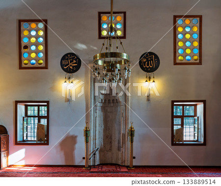 Mihrab, chandelier, and stained glass windows inside Shems-i Tebrizi Mosque and Tomb, Konya, Turkey. Mihrab, chandelier, and stained glass windows inside Shems-i Tebrizi Mosque and Tomb, Konya, Turkey. 133889514