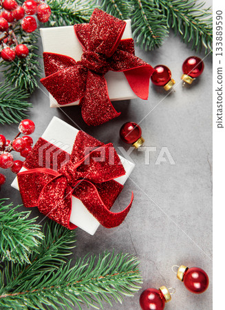Christmas gifts and decorations on gray background Christmas gifts and decorations on gray background 133889590