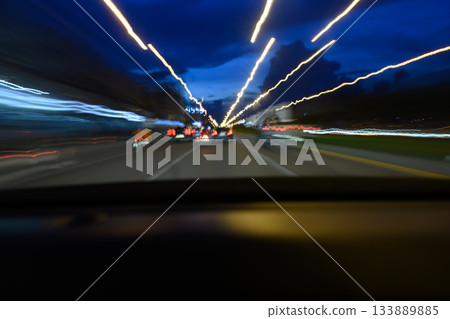 Road view while driving, shot from inside the car. 133889885
