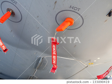 Remove before flight safety covers on aircraft underside 133890419