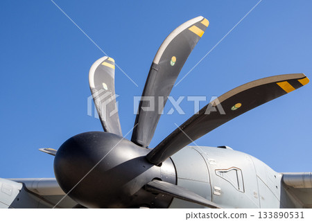 Tactical airlifter cockpit and fuselage structure on airbase apron 133890531
