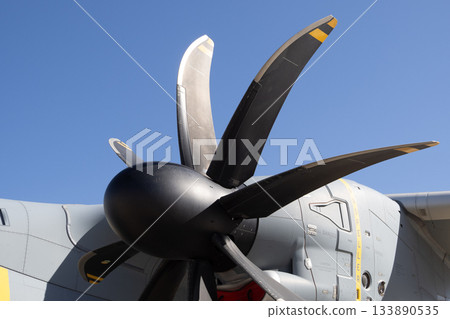 Close view of propeller assembly on tactical transport aircraft Close view of propeller assembly on tactical transport aircraft 133890535