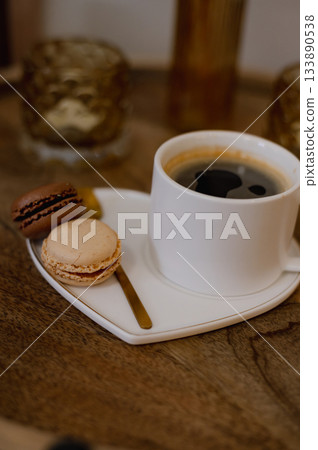 Warm cup of coffee served to a client in a beauty nails salon, creating a cozy and relaxing atmosphere. 133890538