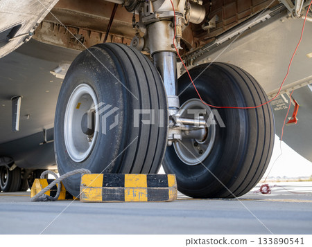 Heavy aircraft landing gear with chocks Heavy aircraft landing gear with chocks 133890541
