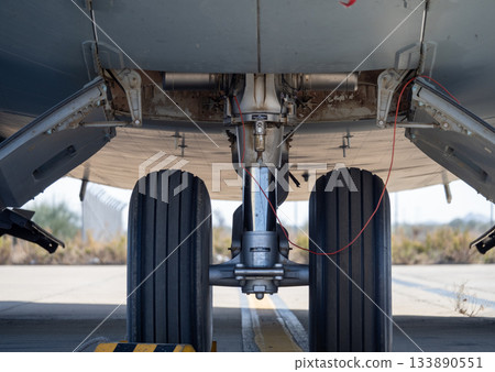 Aircraft nose landing gear under fuselage with open bay doors Aircraft nose landing gear under fuselage with open bay doors 133890551
