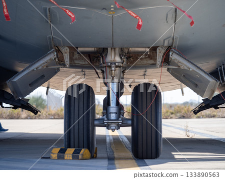 Aircraft nose landing gear with safety pins and open panels Aircraft nose landing gear with safety pins and open panels 133890563