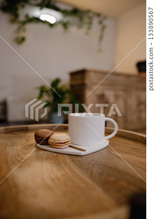 Warm cup of coffee served to a client in a beauty nails salon, creating a cozy and relaxing atmosphere. Warm cup of coffee served to a client in a beauty nails salon, creating a cozy and relaxing atmosphere. 133890567
