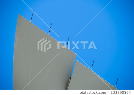 Vertical stabilizer with static discharge wicks against blue sky Vertical stabilizer with static discharge wicks against blue sky 133890594