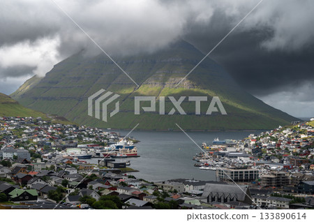Breathtaking panoramic view of Klaksvik city, nestled among fjords and mountains in the Faroe Islands, Denmark, North Atlantic. Breathtaking panoramic view of Klaksvik city, nestled among fjords and mountains in the Faroe Islands, Denmark, North Atlantic. 133890614