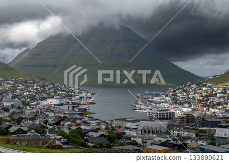 Breathtaking panoramic view of Klaksvik city, nestled among fjords and mountains in the Faroe Islands, Denmark, North Atlantic. Breathtaking panoramic view of Klaksvik city, nestled among fjords and mountains in the Faroe Islands, Denmark, North Atlantic. 133890621