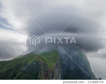 Kallur lighthouse on green hills of Kalsoy island, Faroe islands, Denmark. Landscape photography. High quality photo Kallur lighthouse on green hills of Kalsoy island, Faroe islands, Denmark. Landscape photography. High quality photo 133890729