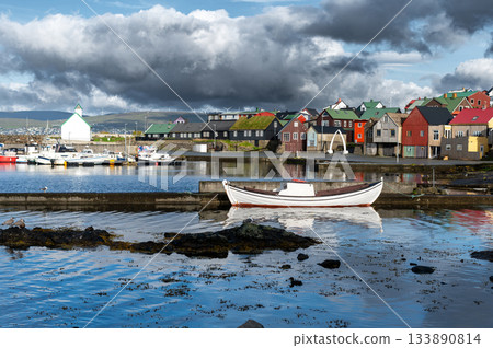 Scenic view of Nolsoy, Faroe Islands, with colorful fishermens houses by the sea, reflecting traditional Nordic charm and coastal lifestyle. Scenic view of Nolsoy, Faroe Islands, with colorful fishermens houses by the sea, reflecting traditional Nordic charm and coastal lifestyle. 133890814