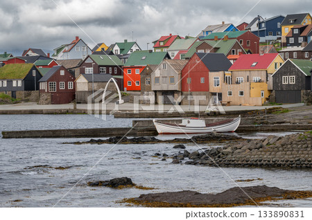 Scenic view of Nolsoy, Faroe Islands, with colorful fishermens houses by the sea, reflecting traditional Nordic charm and coastal lifestyle. Scenic view of Nolsoy, Faroe Islands, with colorful fishermens houses by the sea, reflecting traditional Nordic charm and coastal lifestyle. 133890831
