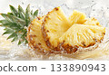 Sliced pineapple fruit splashing in fresh clear water 133890943