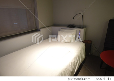 A hotel room with a semi-double bed 133891015