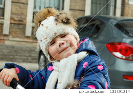Cute Adorable Toddler Having Fun Times and Adventures at the Local Neighborhood Playground. Healthy happy baby child playing in the park. Stylish clothes for kids 133891214