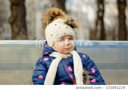 Cute Adorable Toddler Having Fun Times and Adventures at the Local Neighborhood Playground. Healthy happy baby child playing in the park. Stylish clothes for kids Cute Adorable Toddler Having Fun Times and Adventures at the Local Neighborhood Playground. Healthy happy baby child playing in the park. Stylish clothes for kids 133891229