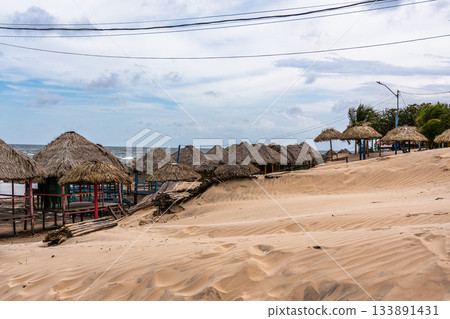 Colorful waters and natural-framed kiosks at Pesqueiro Beach, Soure in Marajo Island, Brazil Colorful waters and natural-framed kiosks at Pesqueiro Beach, Soure in Marajo Island, Brazil 133891431