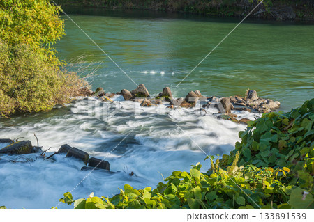 Rapid currents flowing from Misu Arai Weir into the Uji River, Fushimi Ward, Kyoto City 133891539