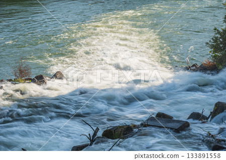 Rapid currents flowing from Misu Arai Weir into the Uji River, Fushimi Ward, Kyoto City 133891558