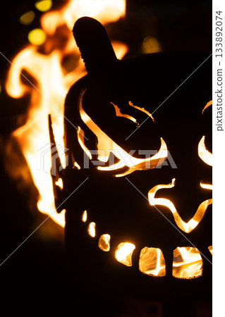 Krampus Festival in Europe. Burning head, blazing flame at night Krampus Festival in Europe. Burning head, blazing flame at night 133892074
