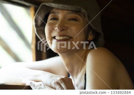 Woman enjoying the sauna 133892884