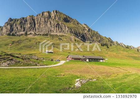 Mountain scenery and farmhouse in the Swiss Alps, Pragelpass, Muotathal, Canton Schwyz, Switzerland 133892970