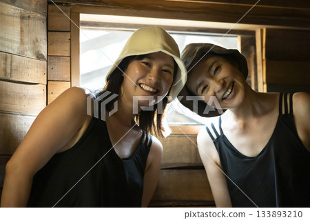 Woman enjoying the sauna Woman enjoying the sauna 133893210