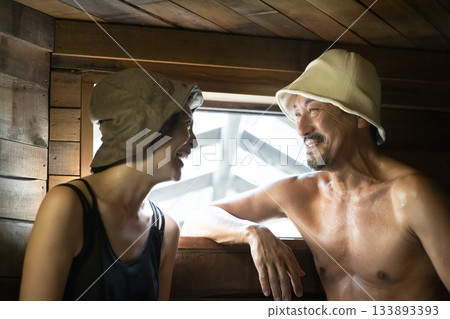 Family enjoying the sauna Family enjoying the sauna 133893393