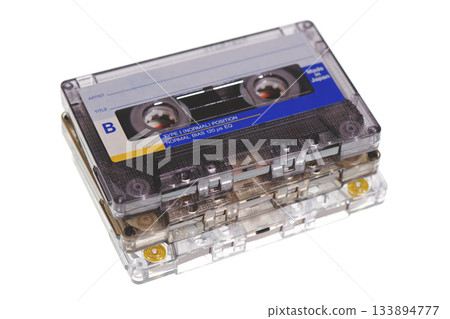 Stack of retro audio cassettes isolated on white background Stack of retro audio cassettes isolated on white background 133894777