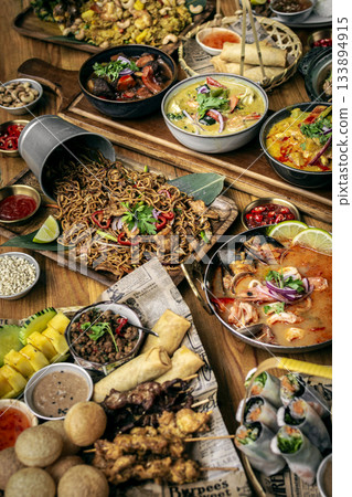 many different thai food dishes on table in modern restaurant in bangkok thailand many different thai food dishes on table in modern restaurant in bangkok thailand 133894915