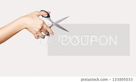 Female Hand is Holding Scissors. Copy Space for your Text. Isolated on White Background. Coupon for Shopping Sales Female Hand is Holding Scissors. Copy Space for your Text. Isolated on White Background. Coupon for Shopping Sales 133895033