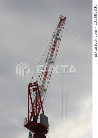 Tower crane boom and sky Tower crane boom and sky 133895830