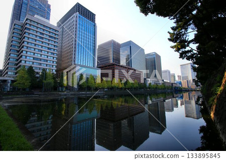 The street known as "Ichi-cho London" stands in front of Edo Castle... [Babasaki Moat] and the ginkgo trees along Hibiya Street 133895845