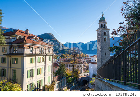 Facade of the Cathedral of San Lorenzo and cityscape, Lugano, Ticino, Switzerland 133896243