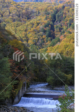 Vibrant autumn foliage colors the Azusa River and mountains in Matsumoto City, Nagano Prefecture Vibrant autumn foliage colors the Azusa River and mountains in Matsumoto City, Nagano Prefecture 133898129