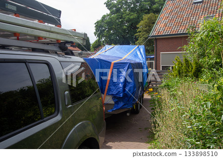 Car with trailer filled with stuff for emigration Car with trailer filled with stuff for emigration 133898510