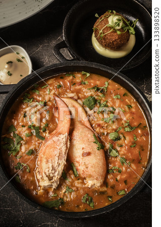 Portuguese traditional food Crab soup risotto meal on restaurant table in lisbon 133898520