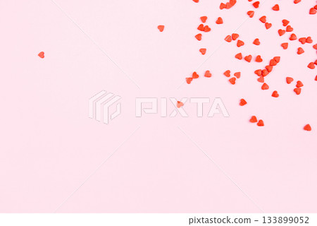 Tiny red hearts on pink background. 133899052