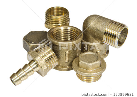 Brass fittings for plumbing pipeline on a white surface Brass fittings for plumbing pipeline on a white surface 133899681
