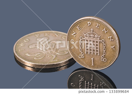 British copper coins isolated on a dark background 133899684