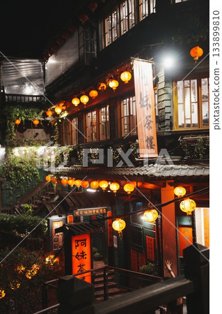Red lanterns illuminate the stone steps. A nostalgic night view of the fantastic Jiufen, Taiwan 133899810
